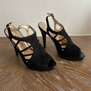 Black heels with buckle . Size 8 1/2